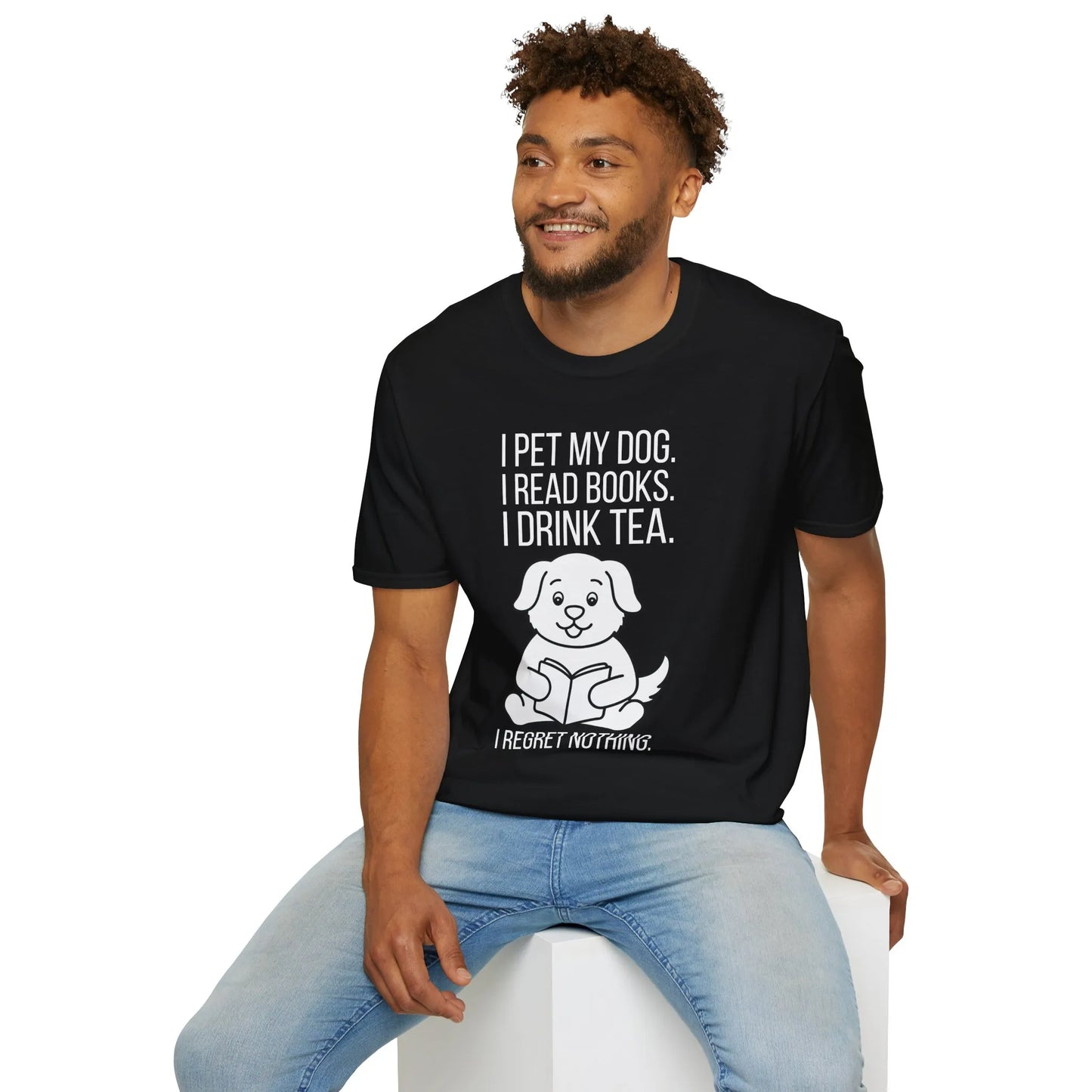 Cozy reading lifestyle featuring a man in a Tea, Tales & Tail Wags T-Shirt, relaxing with a book and a dog, perfect for book lovers.