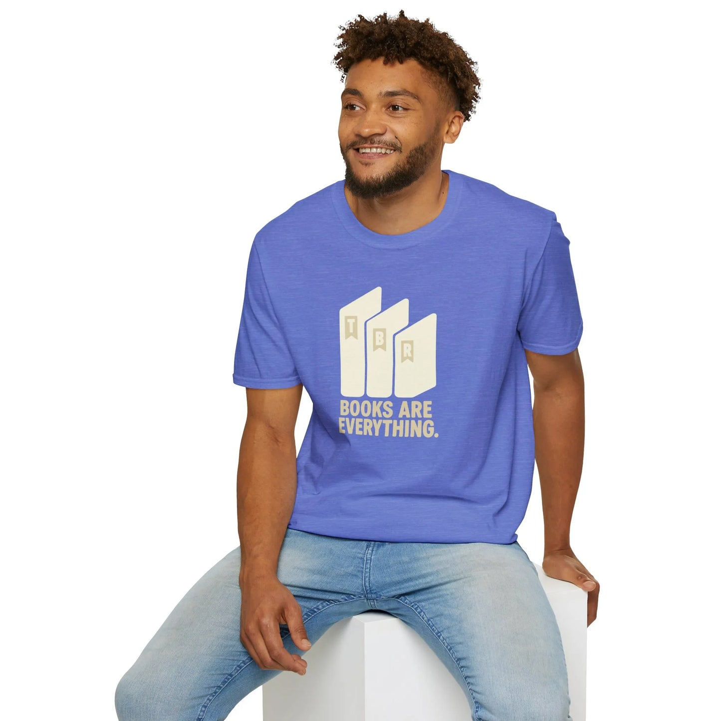 A relaxed fit t-shirt featuring 'Books Are Everything' on a warm day, perfect for book lovers enjoying cozy reading vibes.