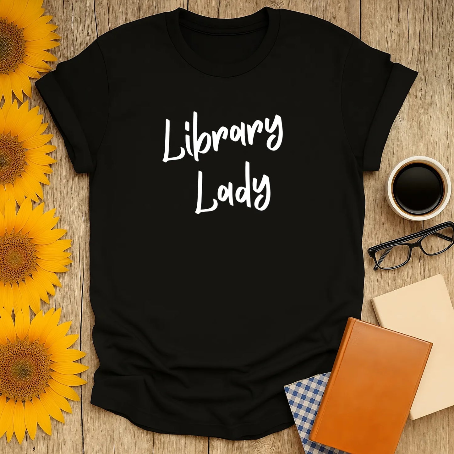 Cozy black Library Lady t-shirt for book lovers, perfect for sipping coffee or tea while reading.