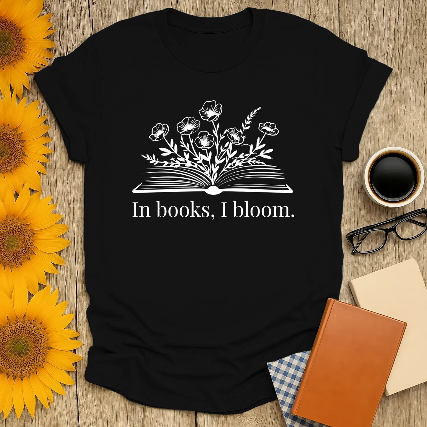 Funny reading tee featuring an open book with flowers and the text 'In books, I bloom,' perfect for literary lovers.