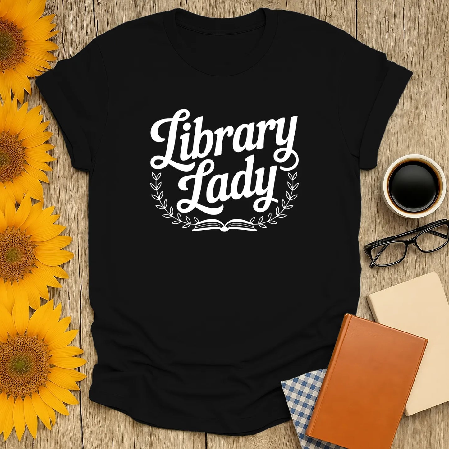 Library Lady T-shirt in black with book-themed design, perfect for cozy cat and coffee-loving book lovers.