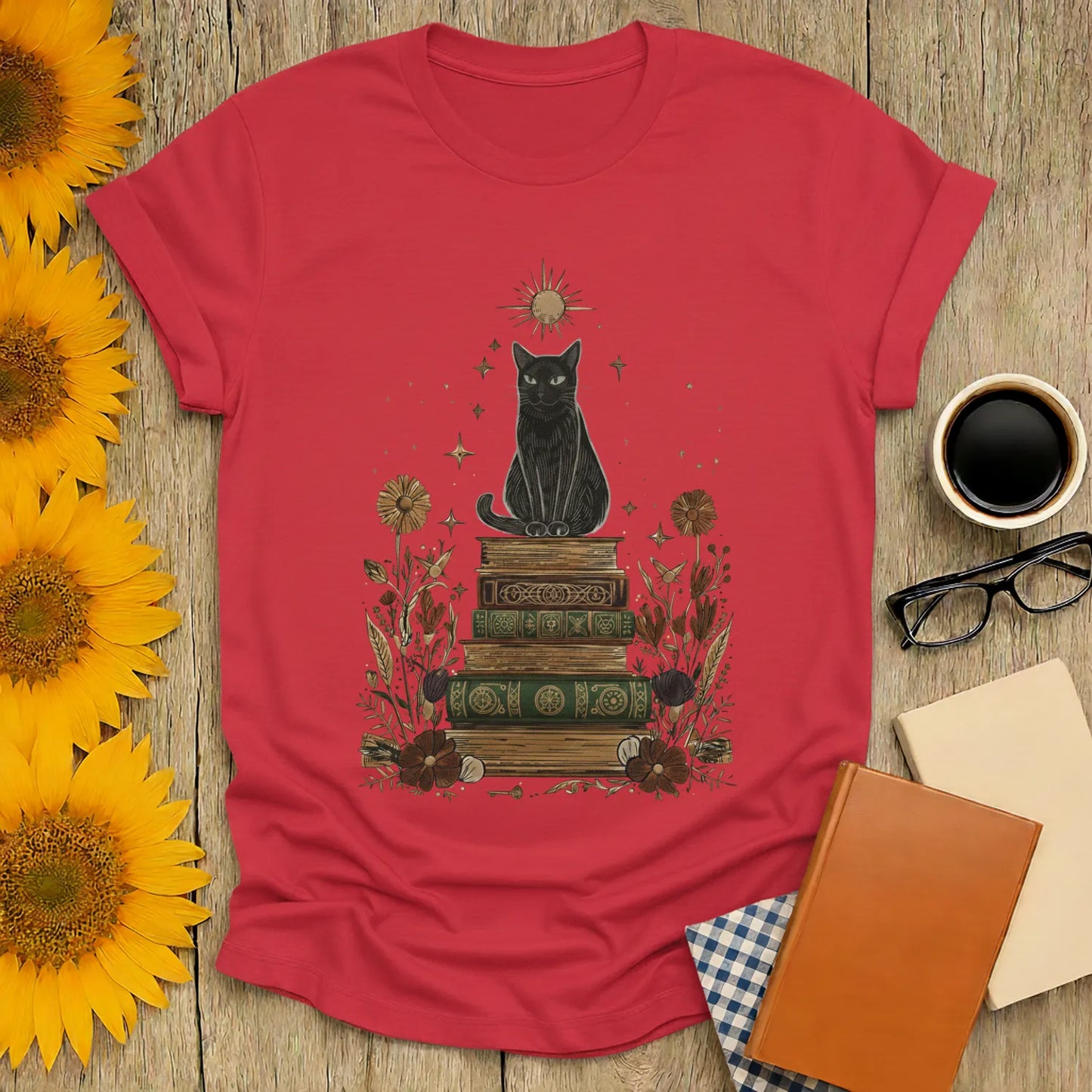 Mystic Cat & Books T-Shirt featuring a black cat on vintage books with floral designs, perfect gift for book lovers.