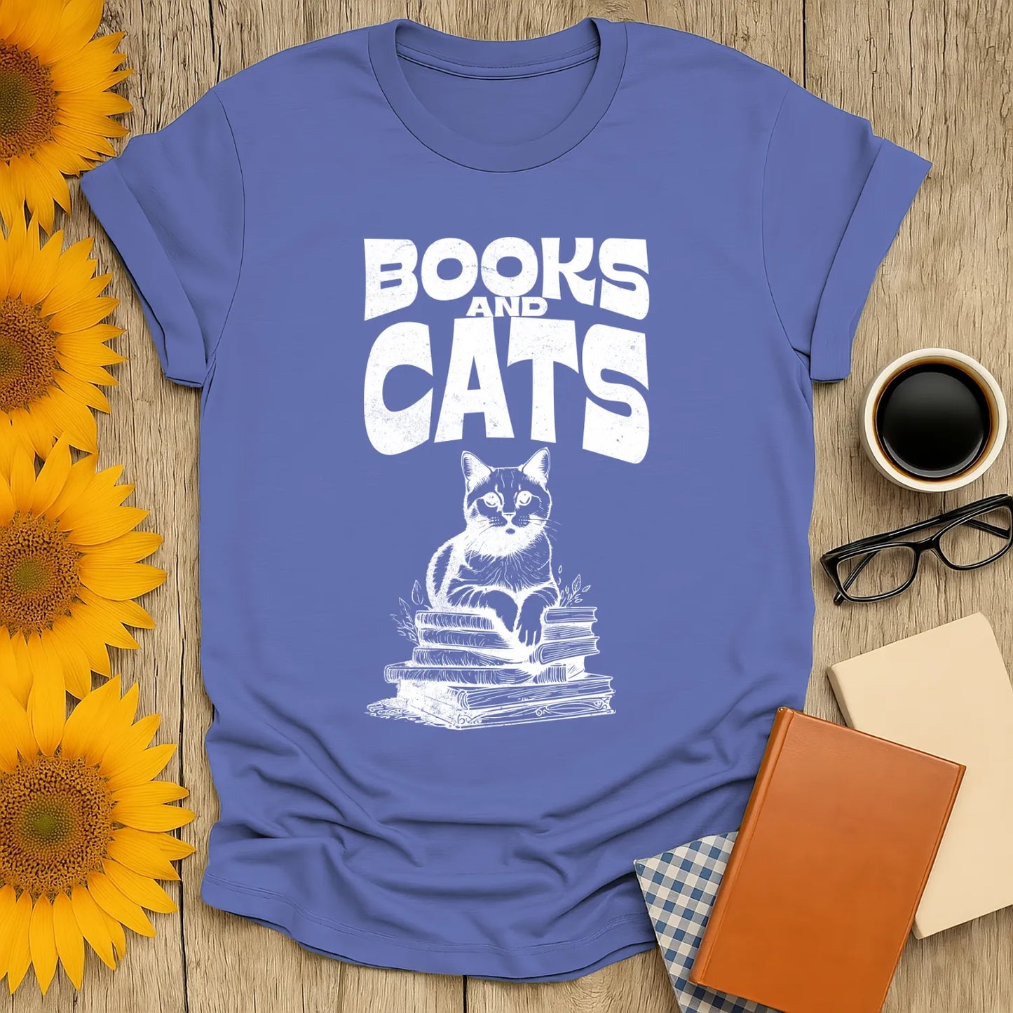 Books & Cats Club T-Shirt featuring a cat on a stack of books, perfect for book lovers and cat enthusiasts.