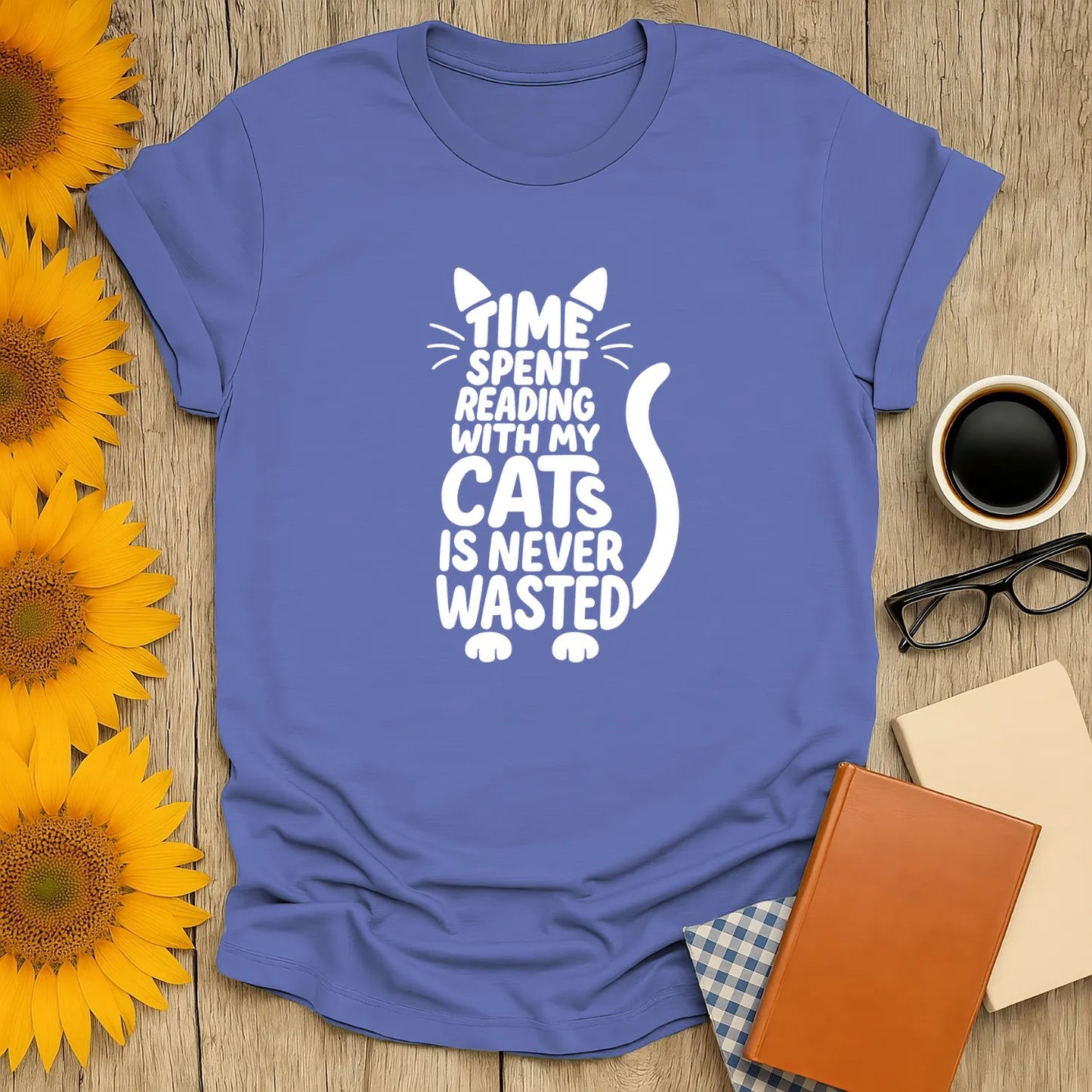Illustration of white cat with text: 'Time spent reading with my cats is never wasted' on blue tee, perfect gift for cat-loving readers.