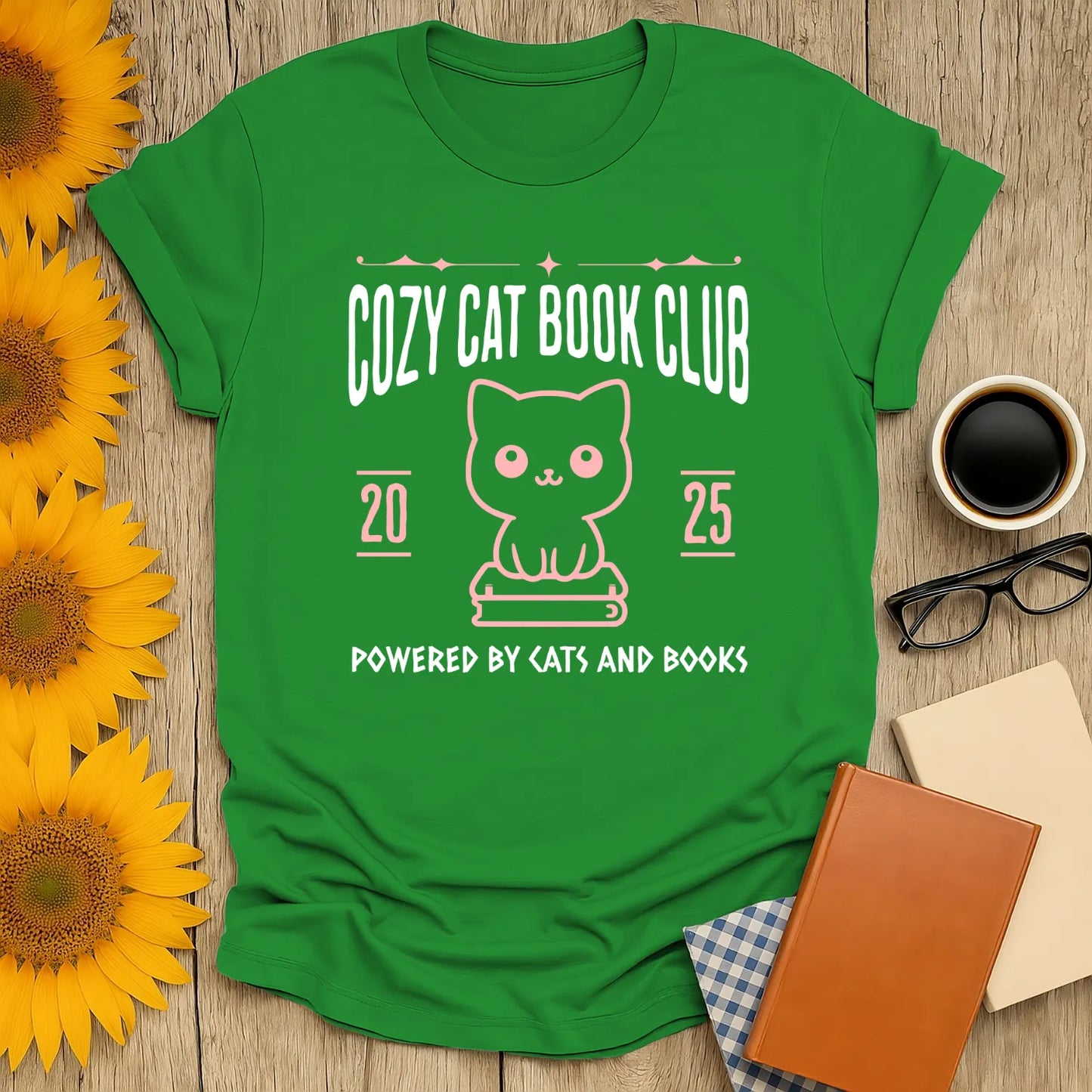 Cozy Cat Book Club T-Shirt featuring a cute kitty graphic and the text 'Powered By Cats And Books', perfect for book lovers.