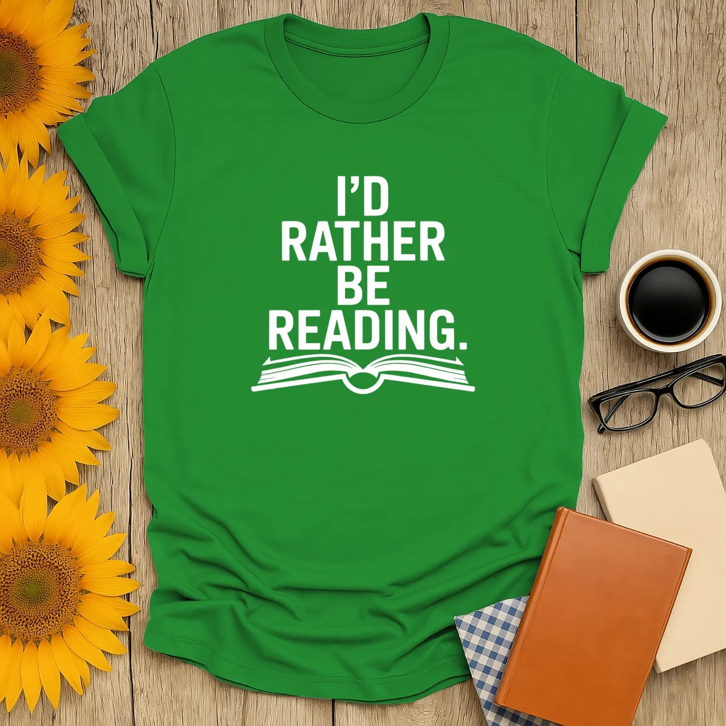 Green unisex t-shirt with "I’d Rather Be Reading" text above an open book design, perfect for cozy book lovers.