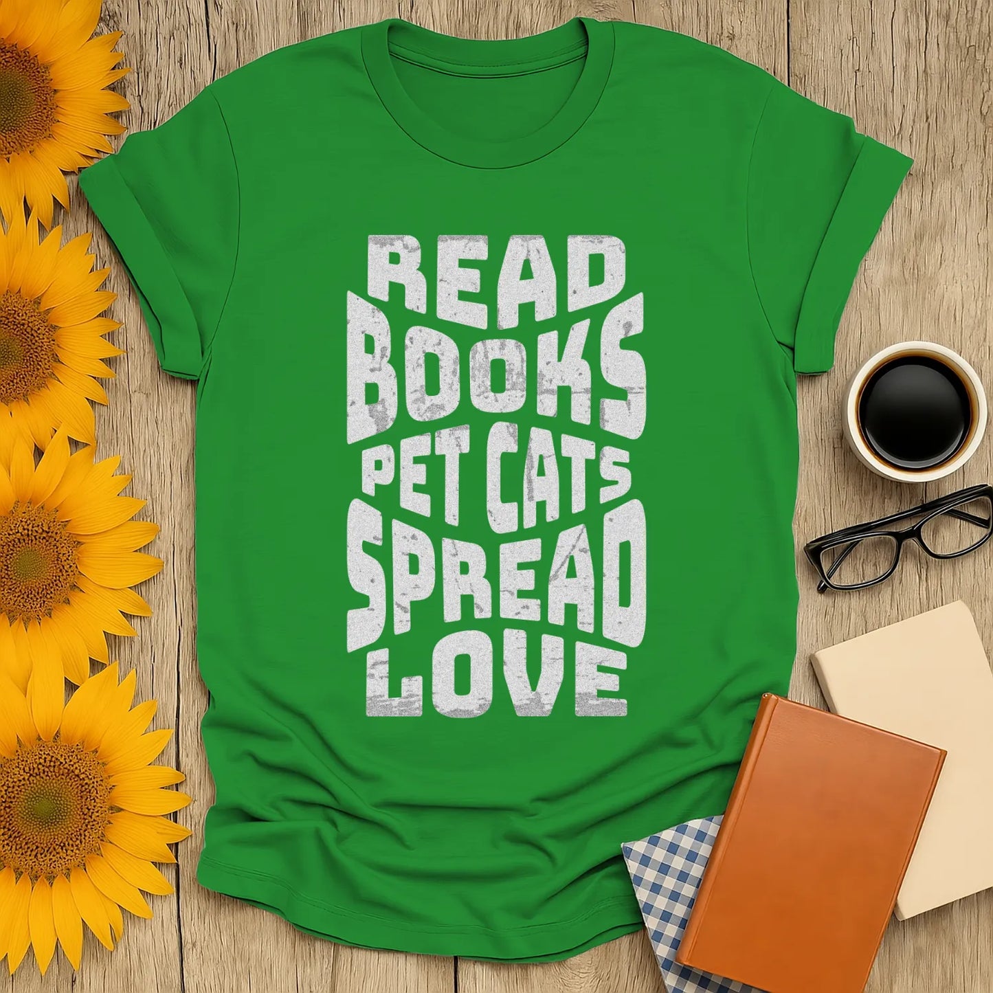Spread Bookish Love T-Shirt featuring bold text: 'Read Books, Pet Cats, Spread Love' on a vibrant green tee, perfect for book lovers.