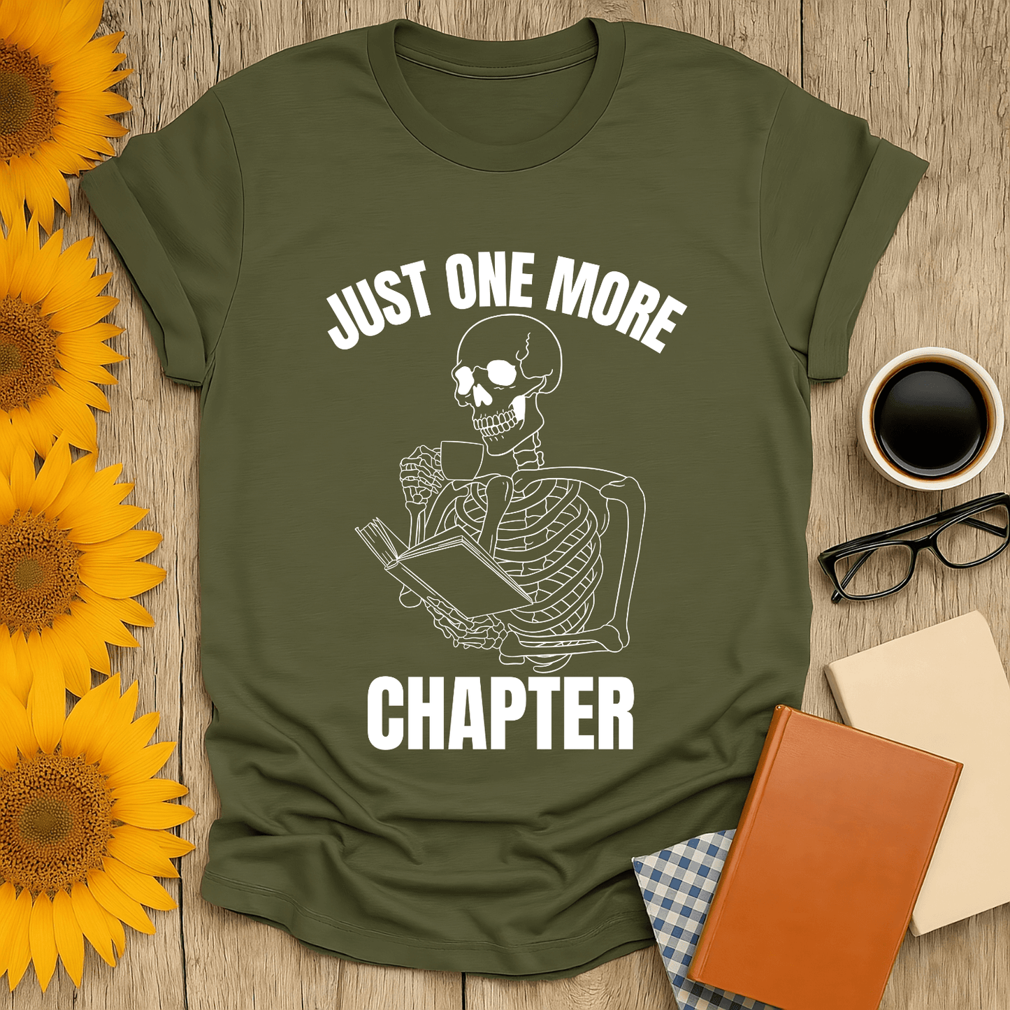 Skeleton Reader T-Shirt featuring a skeleton holding a book, perfect for book lovers. Made of soft, breathable cotton.