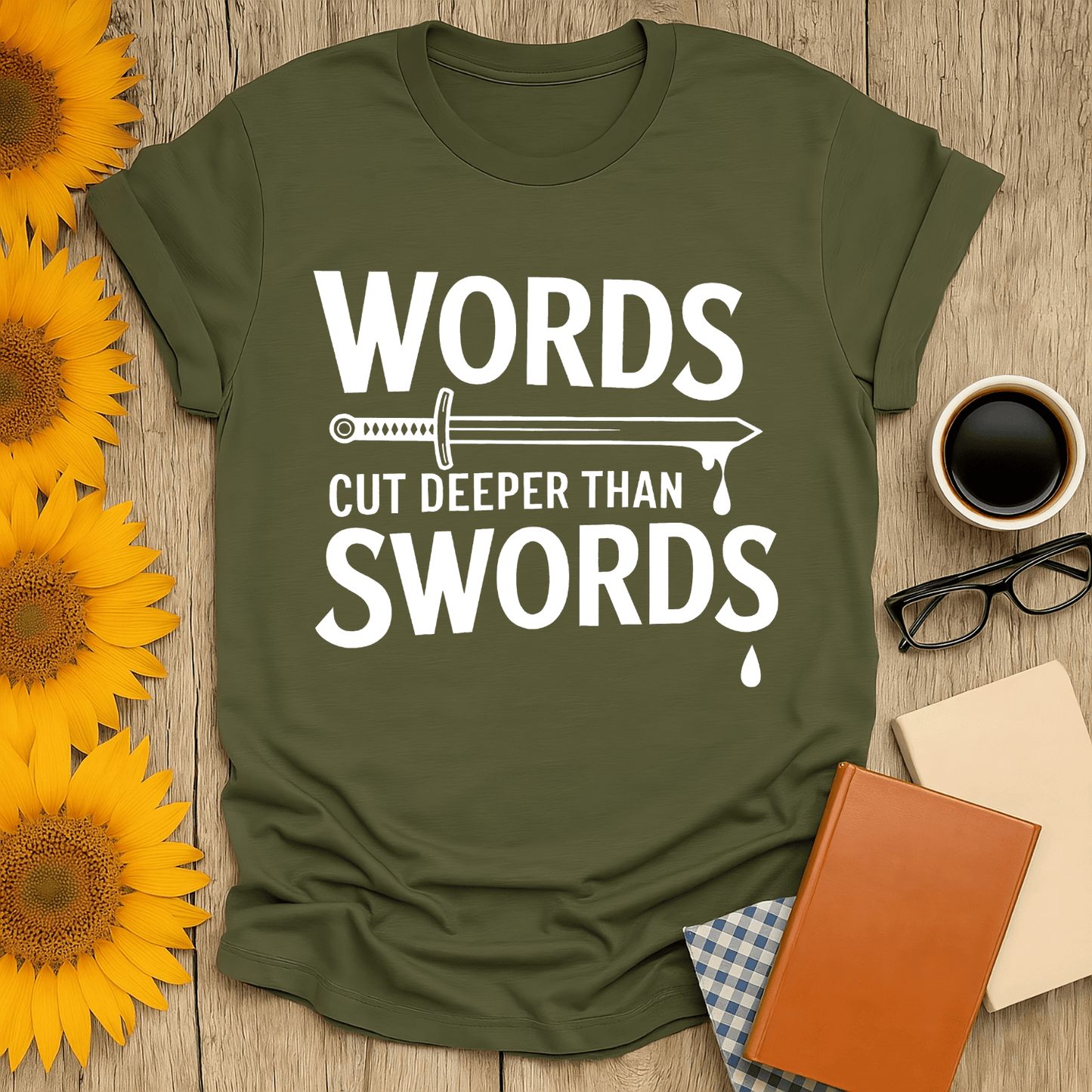 Words Cut Deeper Than Swords T-Shirt in olive green, perfect for book lovers, made from 100% ring-spun cotton.