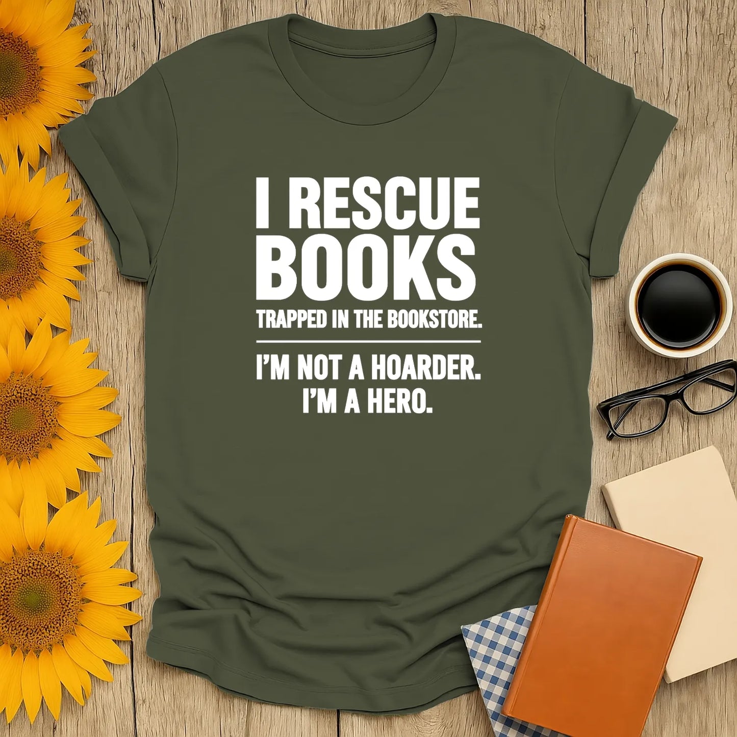 A cozy book lover shirt reads "I Rescue Books Trapped in the Bookstore. I'm Not a Hoarder, I'm a Hero." Perfect gift for readers!