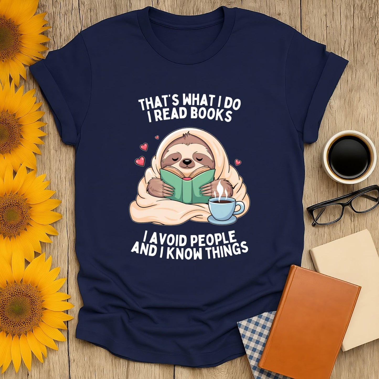 Sloth reading a book on a navy t-shirt with the phrase 'I avoid people and I know things' for book lovers.