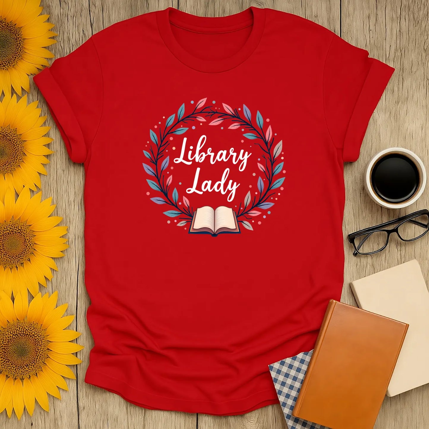 Cozy red Library Lady t-shirt with whimsical book illustration, perfect for book lovers and cat coffee enthusiasts.