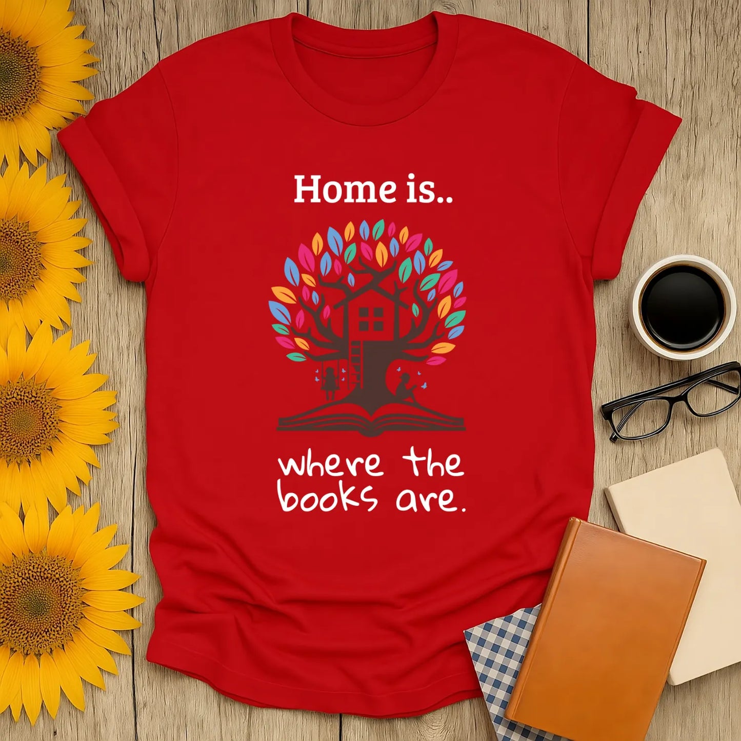 Home of Books T-Shirt in red featuring a treehouse and the text "Home is where the books are", perfect for cozy book lovers.
