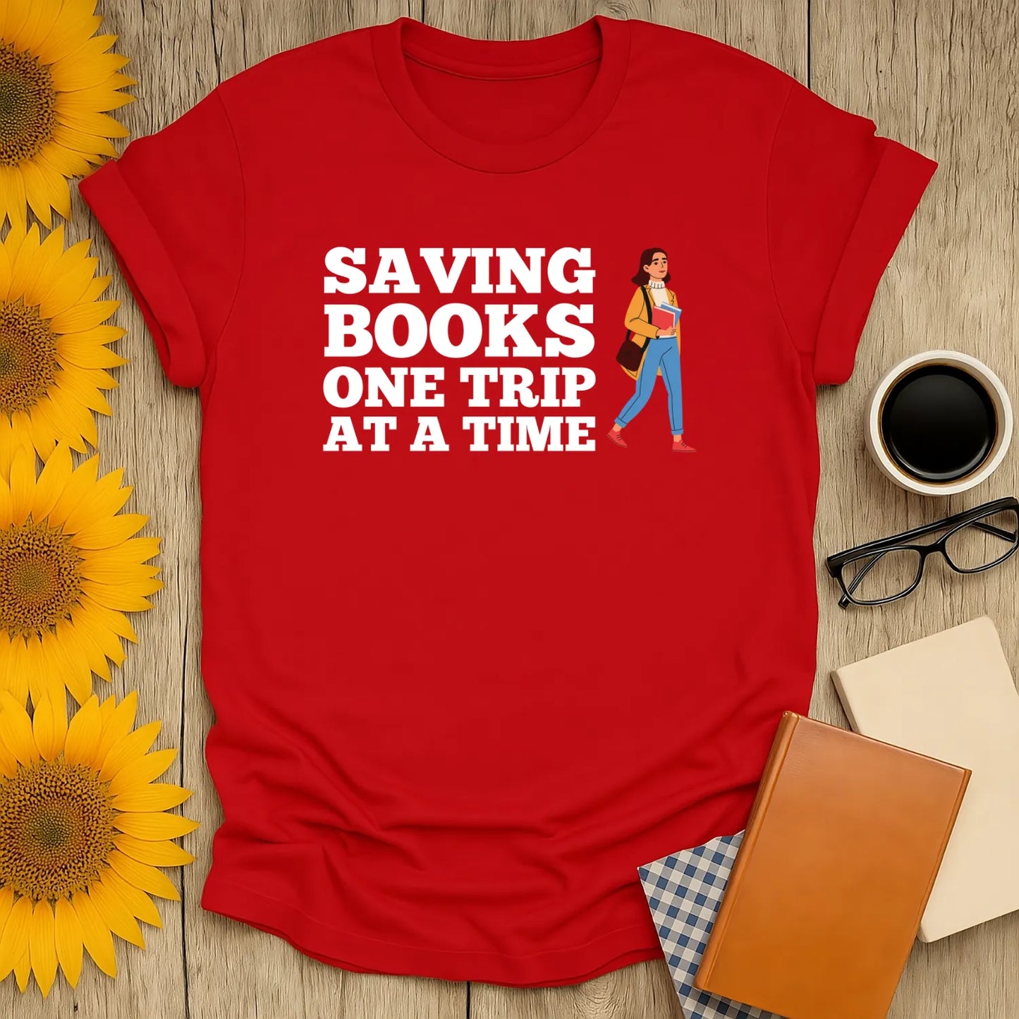 Cozy red book lover shirt featuring a character saying 'Saving Books One Trip at a Time', perfect gift for literary fans.