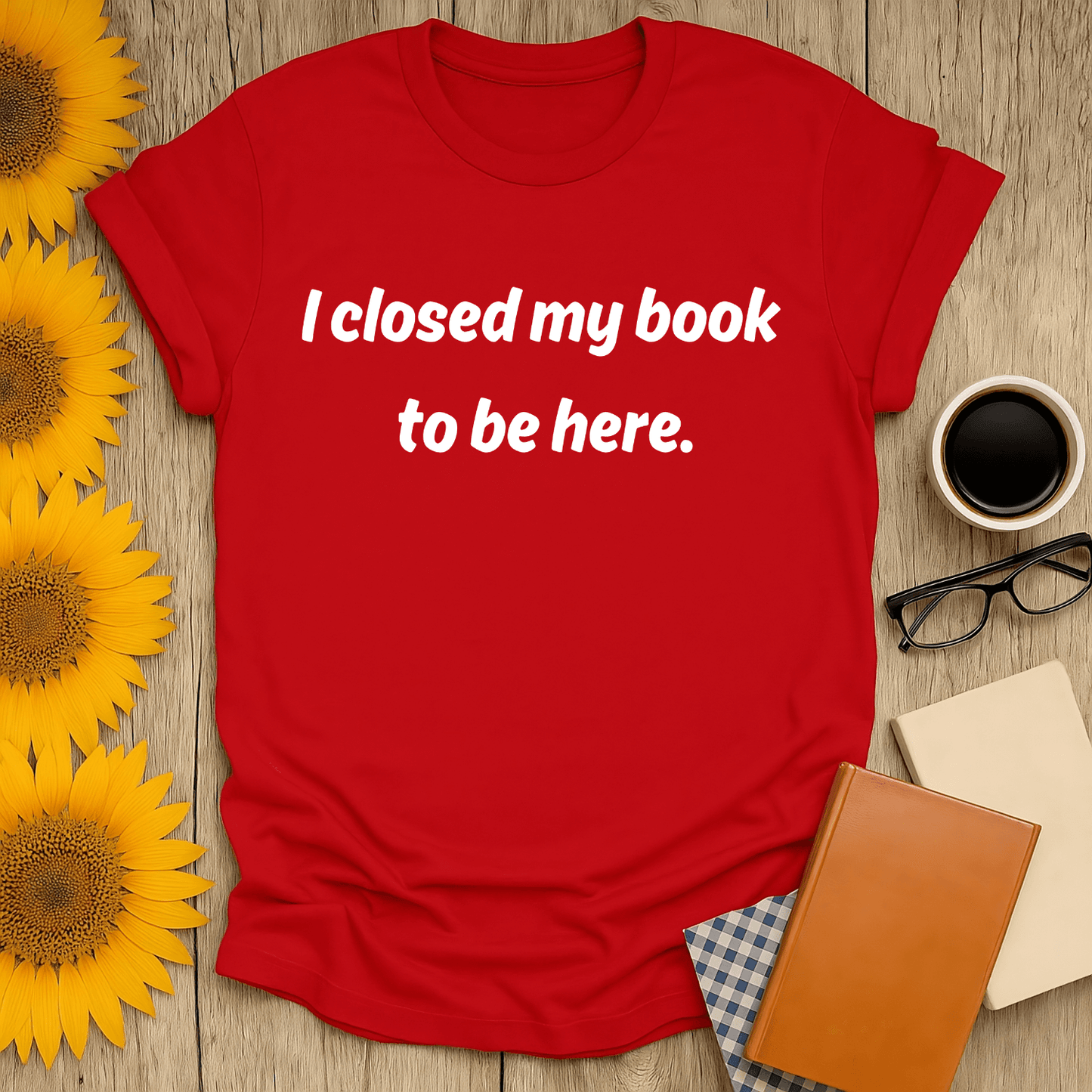 Red unisex t-shirt with text 'I closed my book to be here', perfect for book lovers. Made of 100% ring-spun cotton.