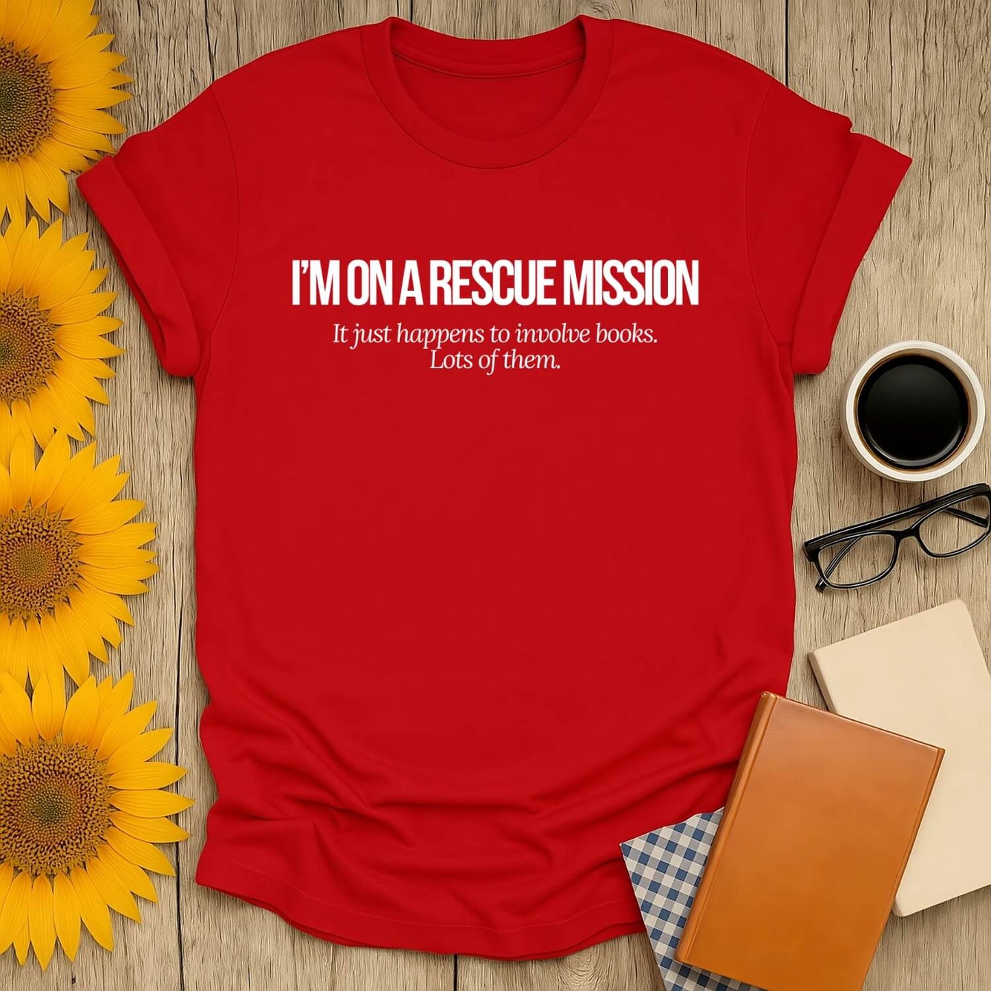 Red t-shirt featuring 'I'M ON A RESCUE MISSION' text, perfect for book lovers. Made of 100% cotton, unisex fit.