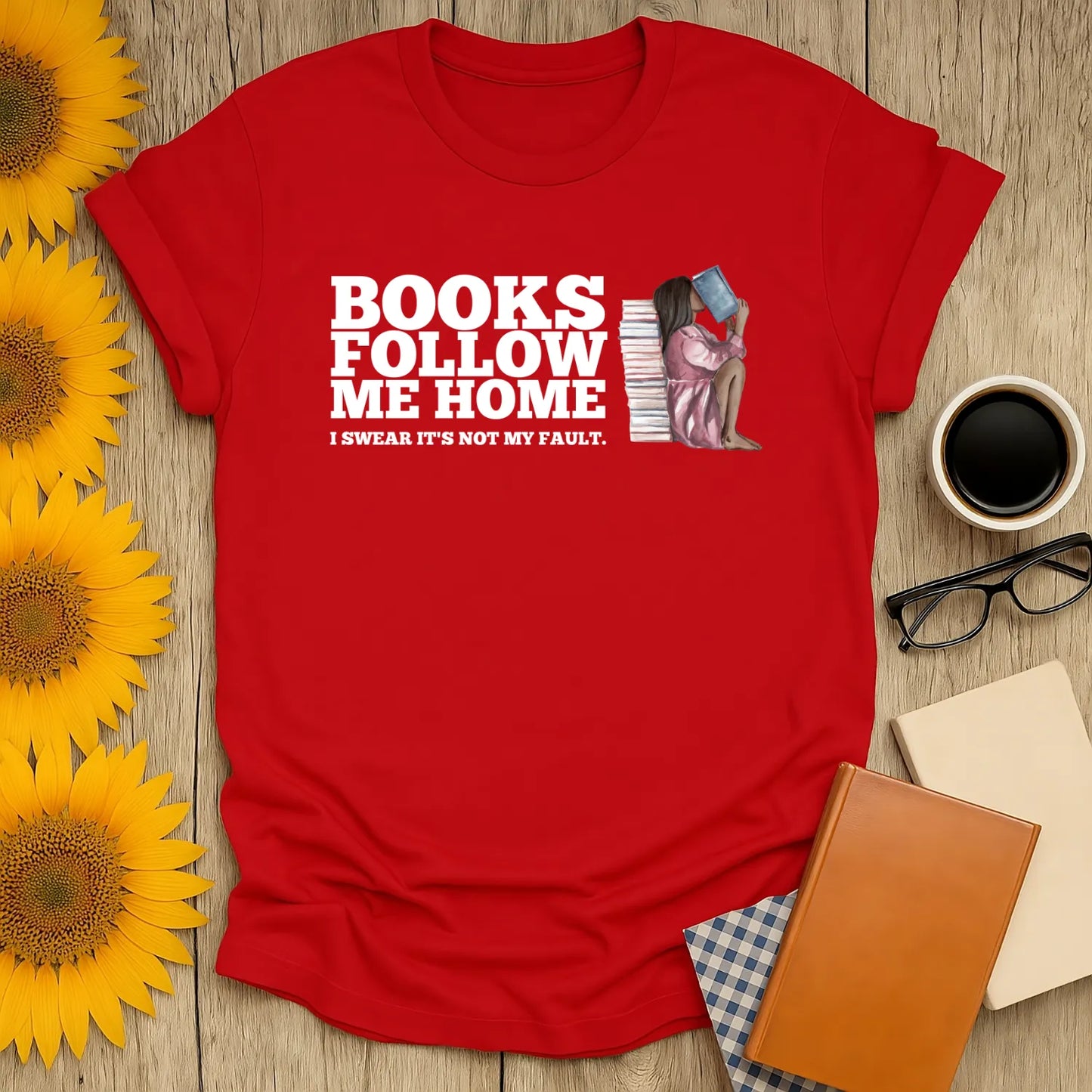 Funny red t-shirt featuring the phrase 'Books Follow Me Home' and a playful illustration—perfect cozy book shirt for readers who love cats, coffee, or tea.