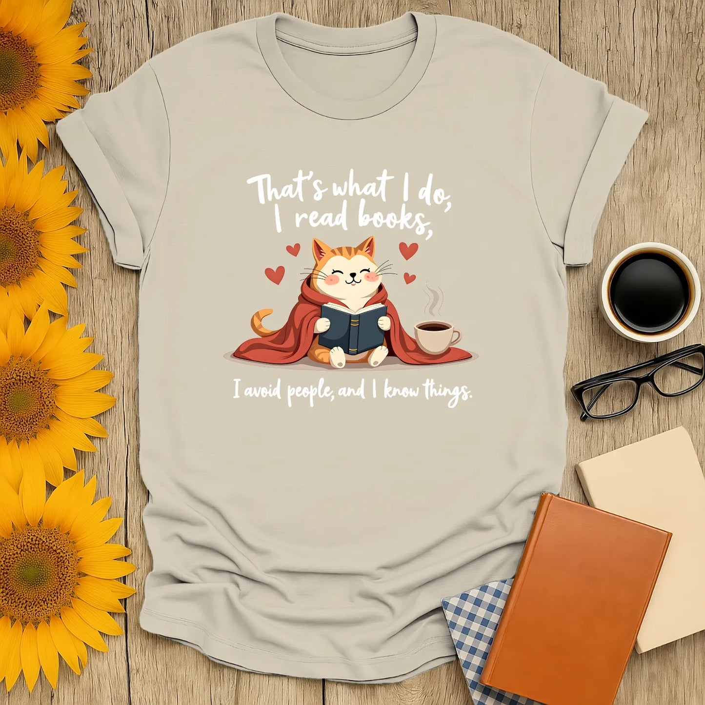Cozy cat reading a book with coffee, text: 'I avoid people, and I know things.' Perfect for book lovers!