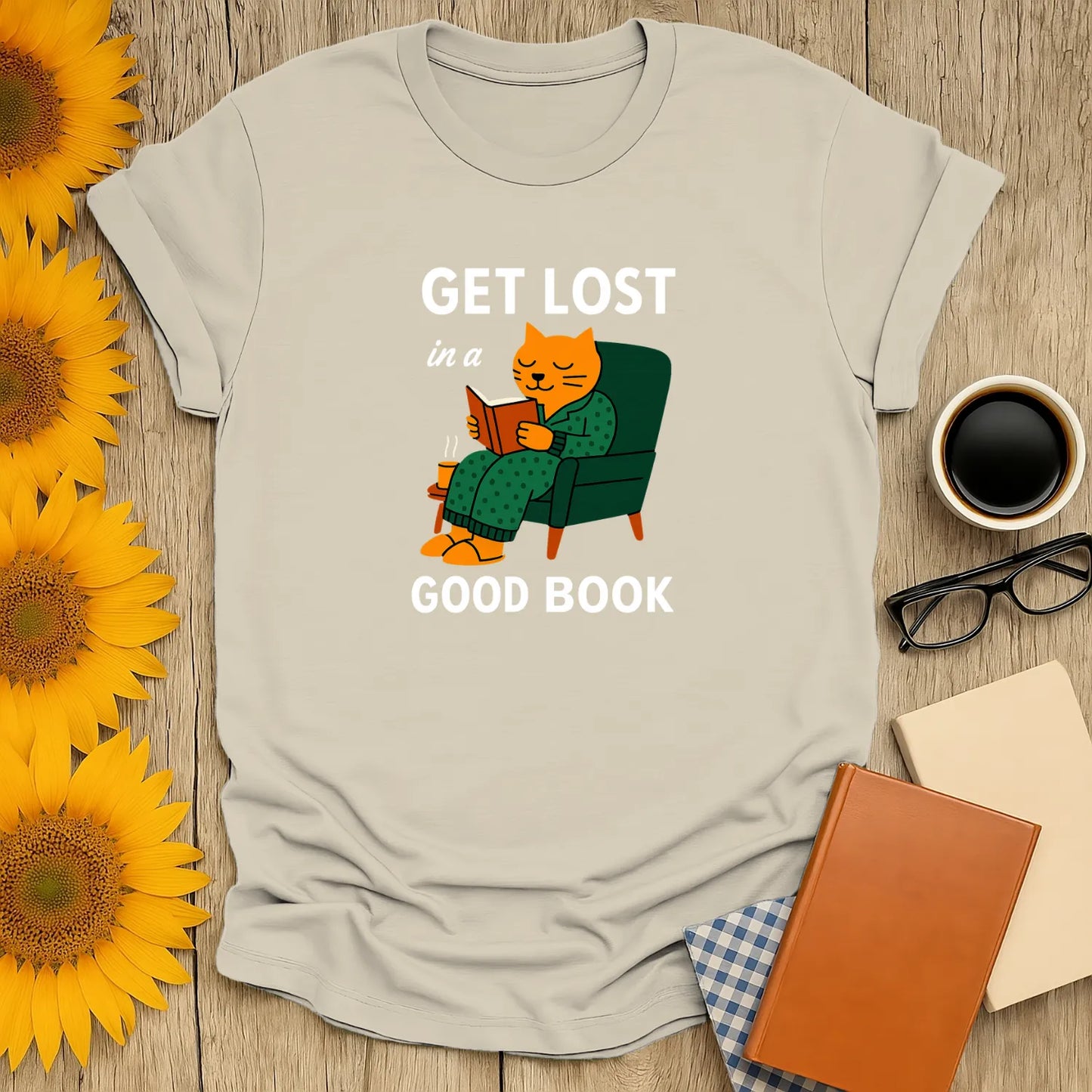 Cozy cat reading shirt with 'Get Lost in a Good Book' text, perfect for book lovers and cat enthusiasts.