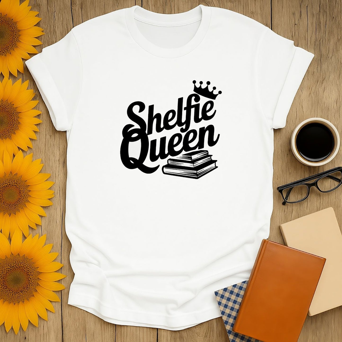 Shelfie Queen T-Shirt featuring a crown and stacked books, perfect for cozy reading lovers and cat coffee fans!