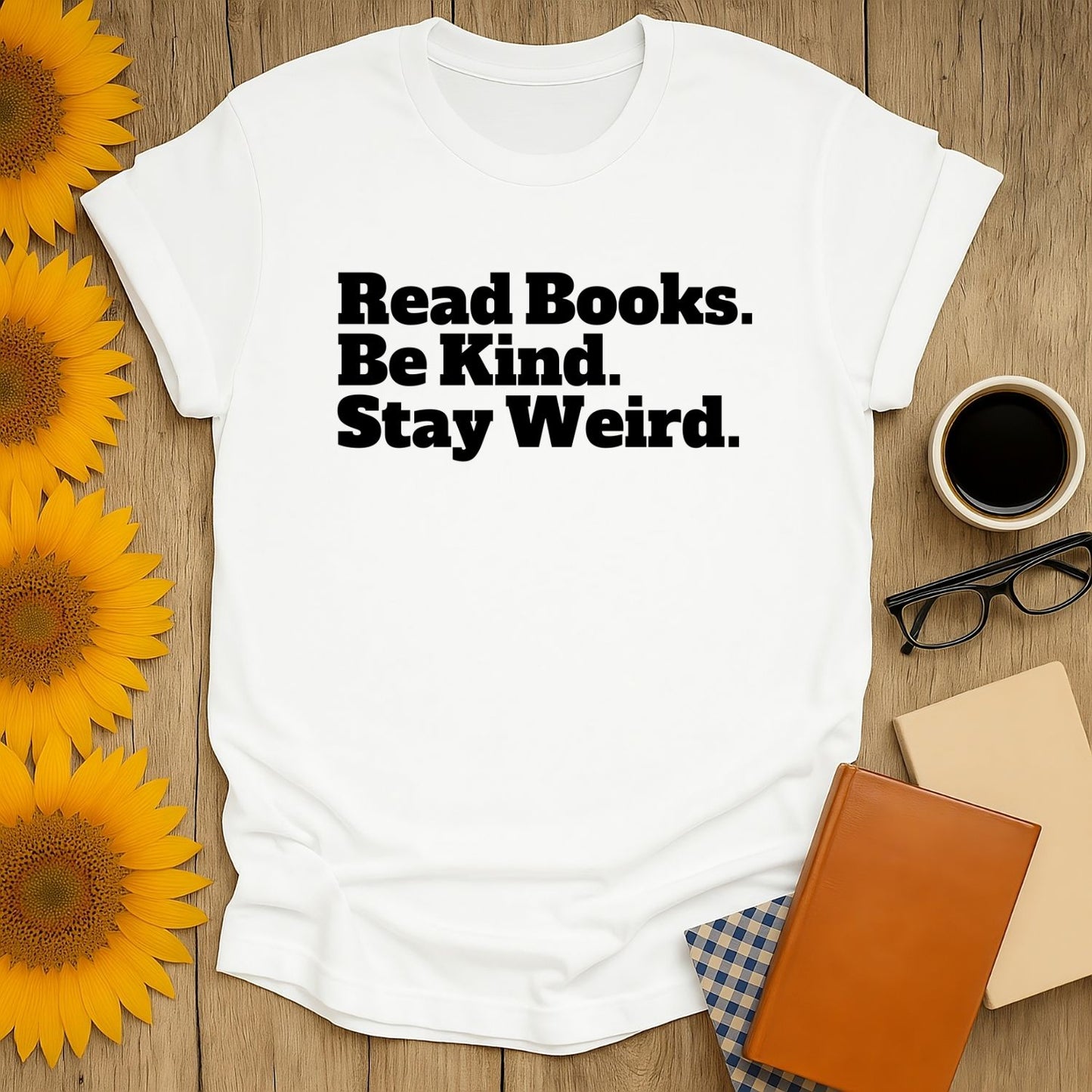 Stay Weird T-Shirt showcases playful text: 'Read Books. Be Kind. Stay Weird.' A cozy top perfect for book lovers and thoughtful gifts.
