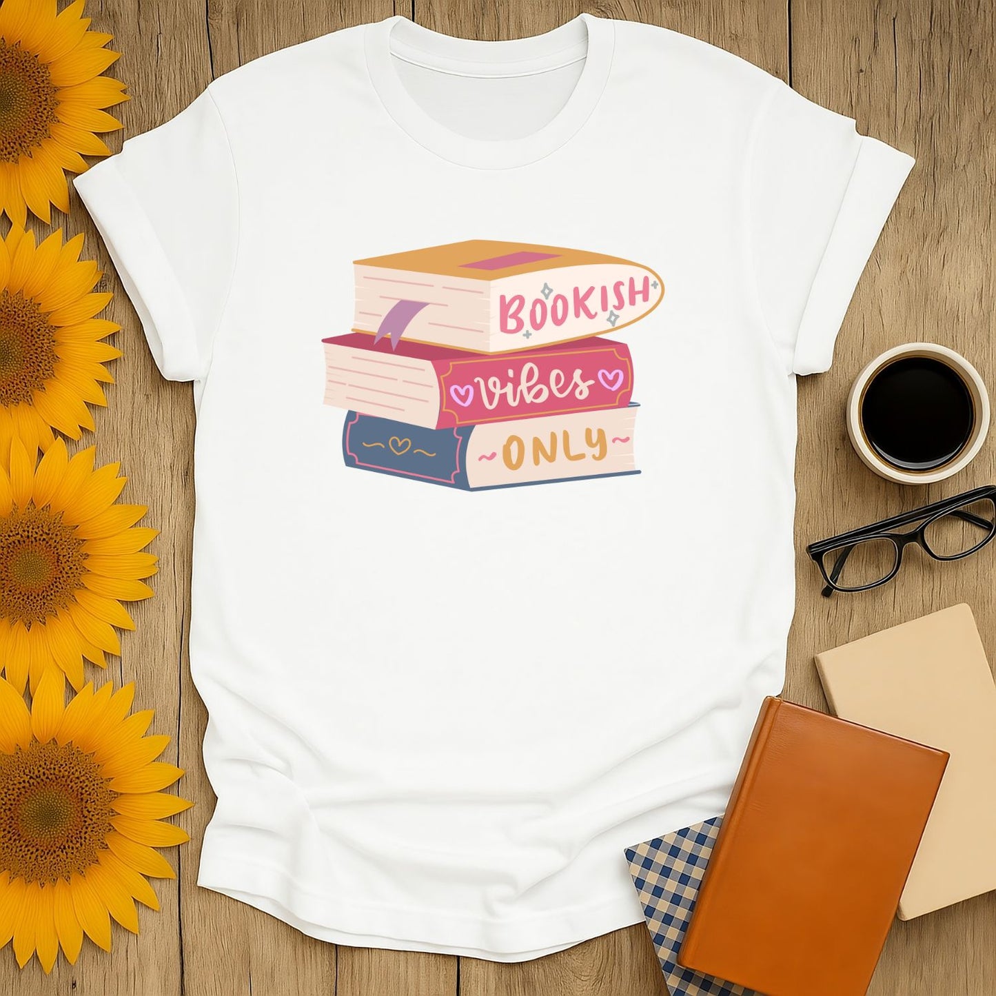 Bookish Vibes T-Shirt with colorful stack of books illustration, perfect cozy book shirt for cat and coffee lovers.