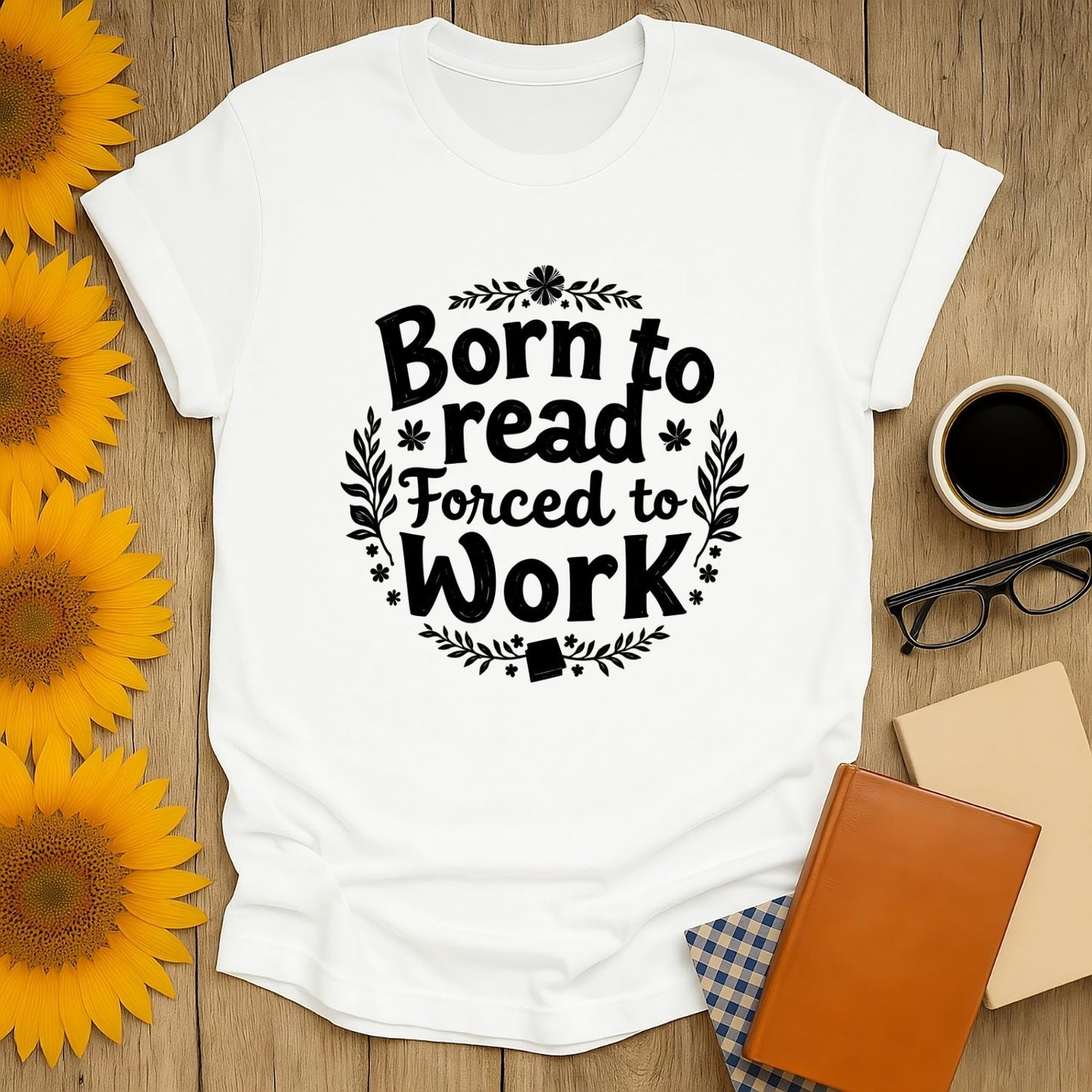 Funny reading tee with 'Born to read, Forced to Work' text; perfect for book lovers who enjoy cats, coffee, and cozy vibes.