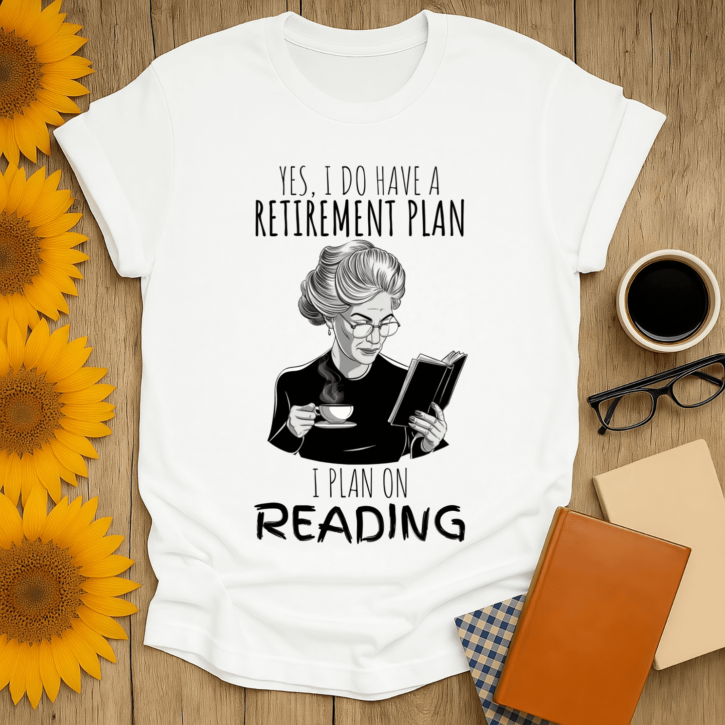 Unisex book lover t-shirt featuring a woman reading with the text about retirement plans in printed design.