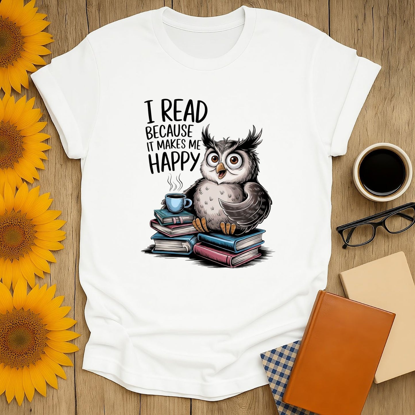 Cozy unisex T-shirt with a whimsical owl saying 'I read because it makes me happy,' perfect for book lovers enjoying coffee or tea.