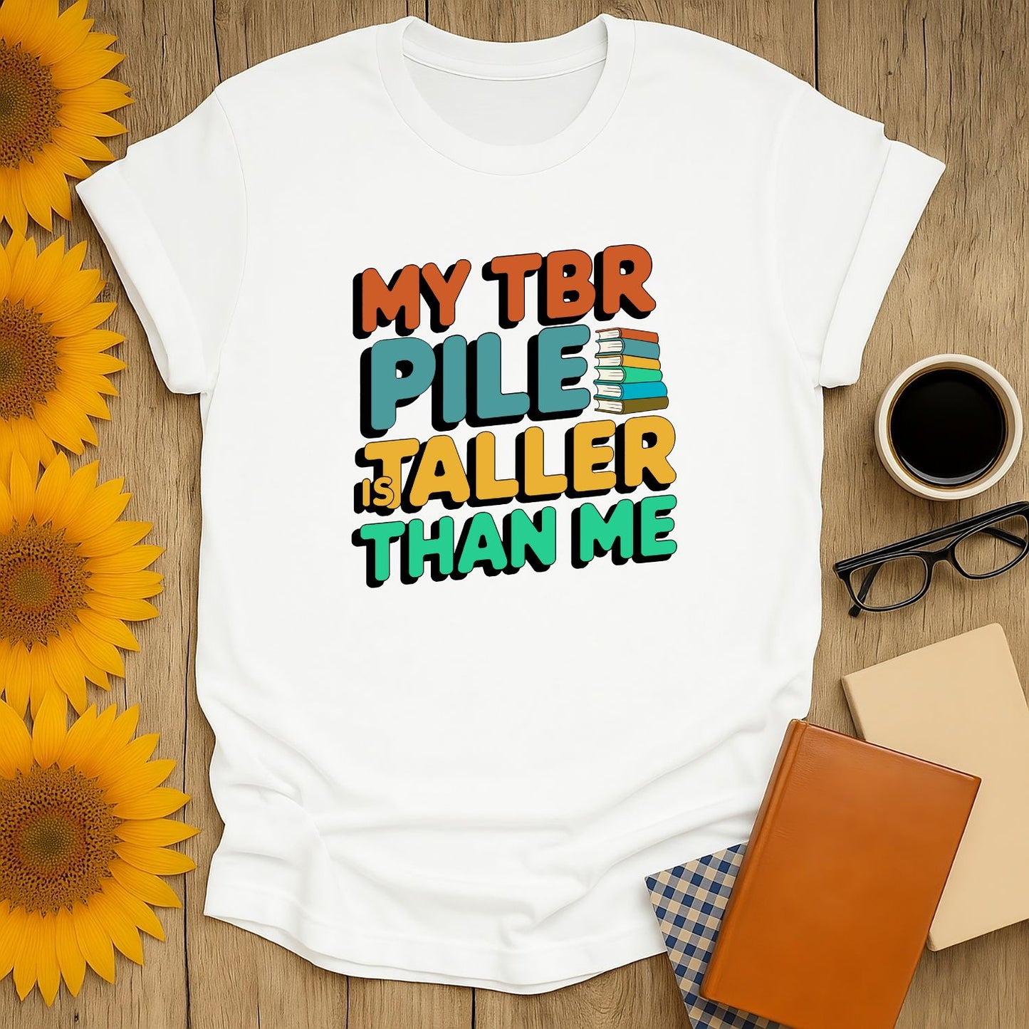 Funny book lover shirt with 'My TBR Pile is Taller Than Me,' perfect for readers who love cats, coffee, or tea.