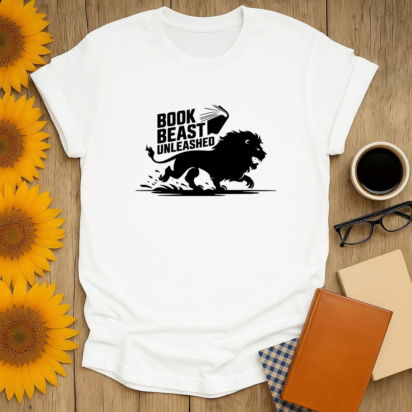 Funny 'Book Beast Unleashed' shirt with a roaring lion and book, perfect for cozy book lovers who enjoy cats, coffee, and humor.