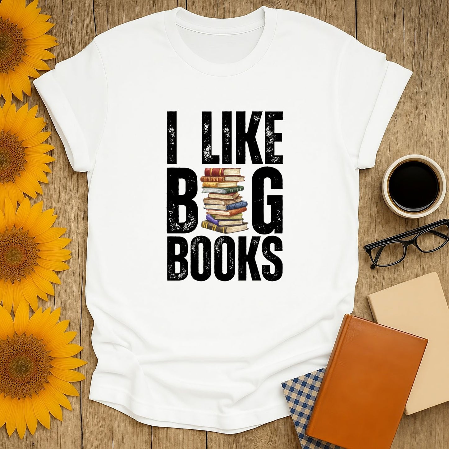 I Like Big Books shirt featuring stacked books design, perfect cozy tee for book lovers who enjoy coffee, tea, and laughs.