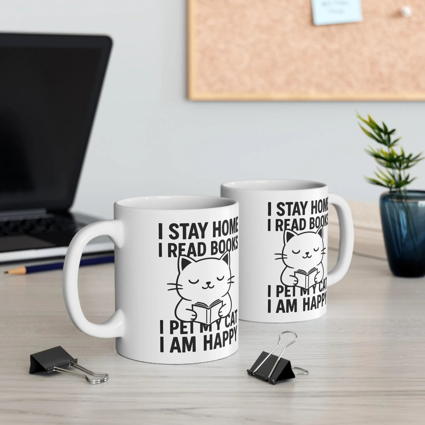 Happy Cat Reader Mug featuring a cute cat reading with text: 'I STAY HOME I READ BOOKS I PET MY CAT I AM HAPPY'. Perfect for cozy moments!