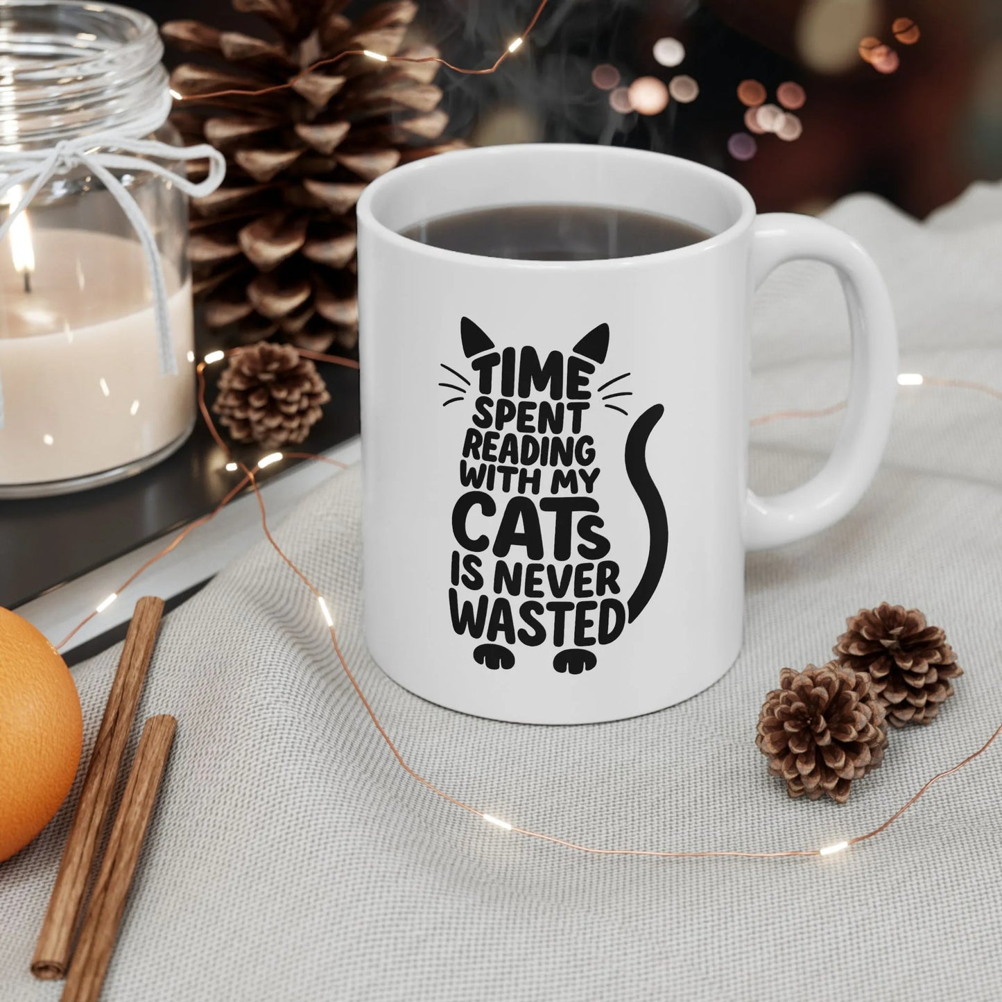 Never Wasted with Cats Mug showcasing a playful cat quote, perfect for cozy reading moments with a purring companion.