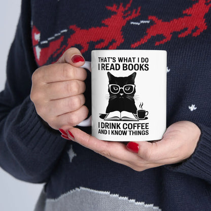 Coffee & Cat Wisdom Mug featuring a black cat with glasses and text about reading books and coffee, perfect gift for cat-loving readers.