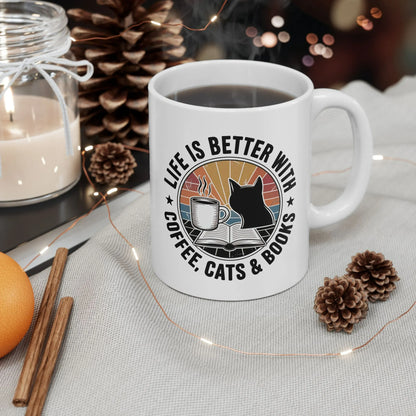 Sunset Reads & Whiskers Mug featuring text 'Life is better with coffee, cats & books' in vibrant colors, perfect for book lovers.