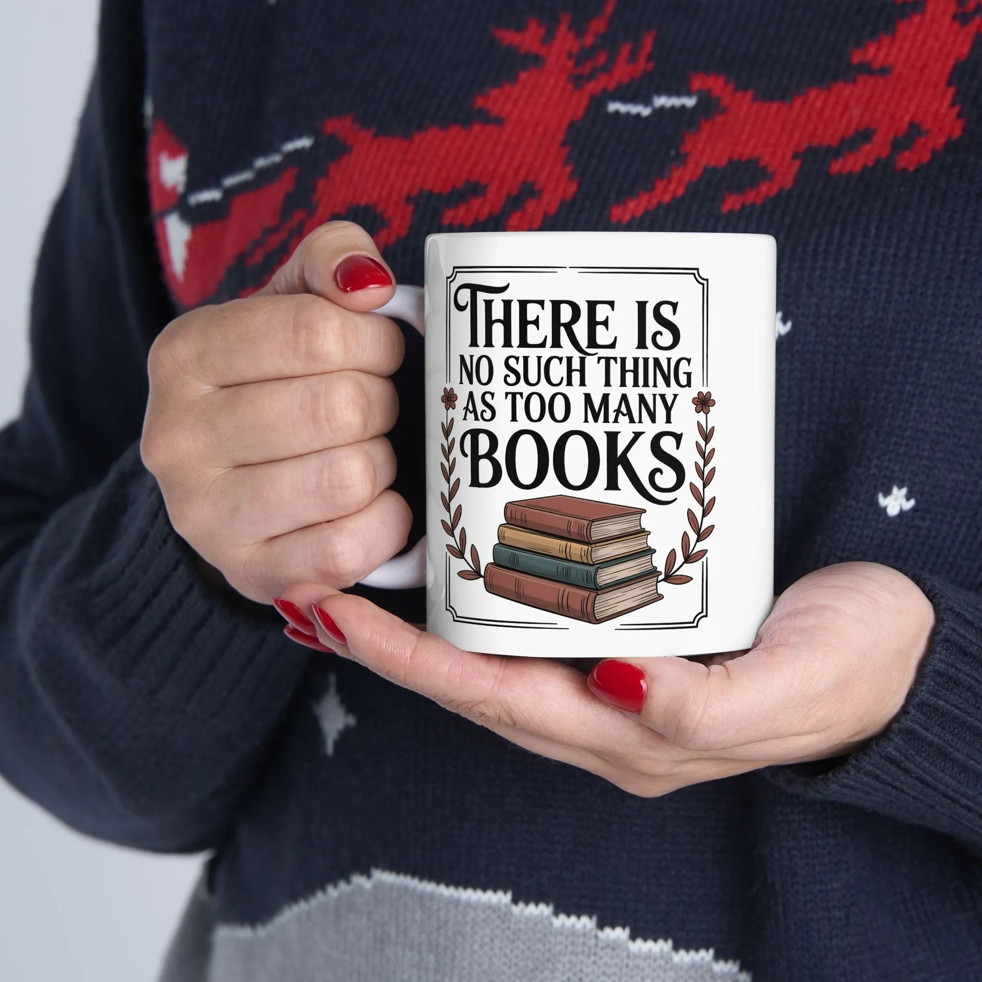 Too Many? Never. Mug featuring the quote 'There is no such thing as too many books' with a stack of books design.