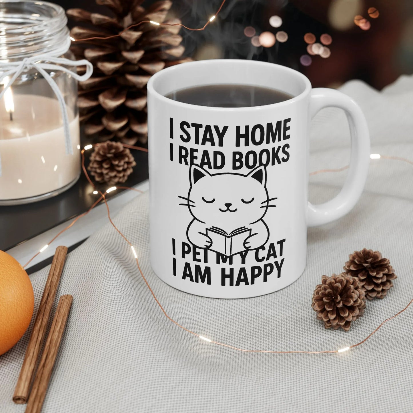 Happy Cat Reader Mug with a cute cat illustration and text: I stay home, I read books, I pet my cat, I am happy.