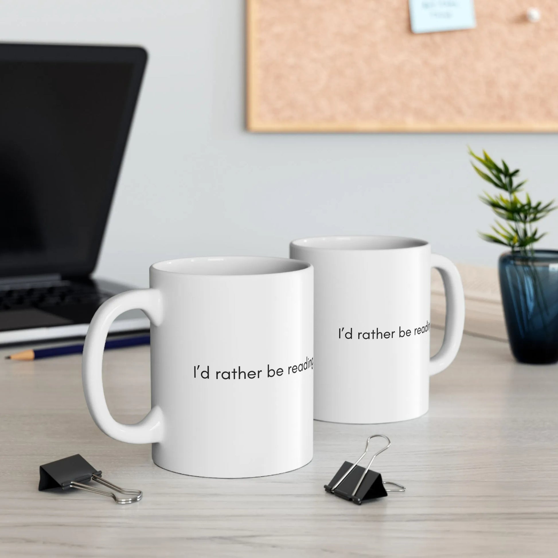 Two Rather Be Reading Mugs on a desk, perfect for cozy reading sessions with coffee or tea, great gift for book lovers.