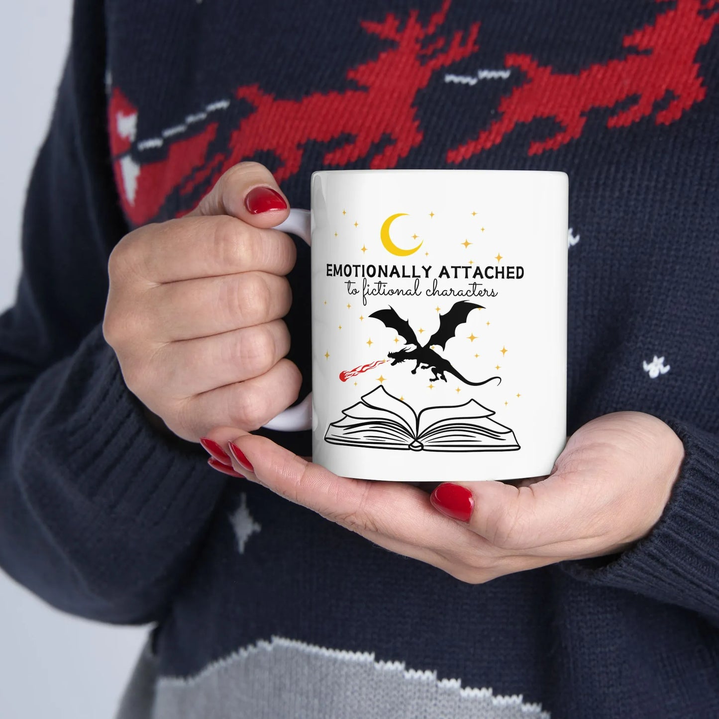 Fictional Characters Mug featuring a design of a dragon and an open book, perfect for book lovers and cozy reading.