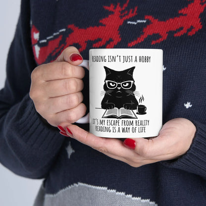 Reading Way of Life Mug featuring a funny cat design with glasses and a coffee cup, ideal for book lovers.