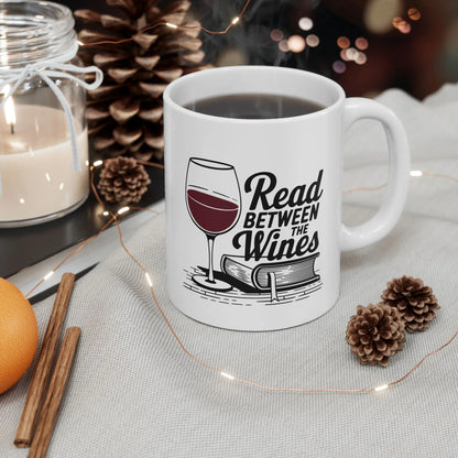 Read Between the Wines Mug featuring a wine glass and book illustration, perfect for cozy reading and humor-loving book lovers.