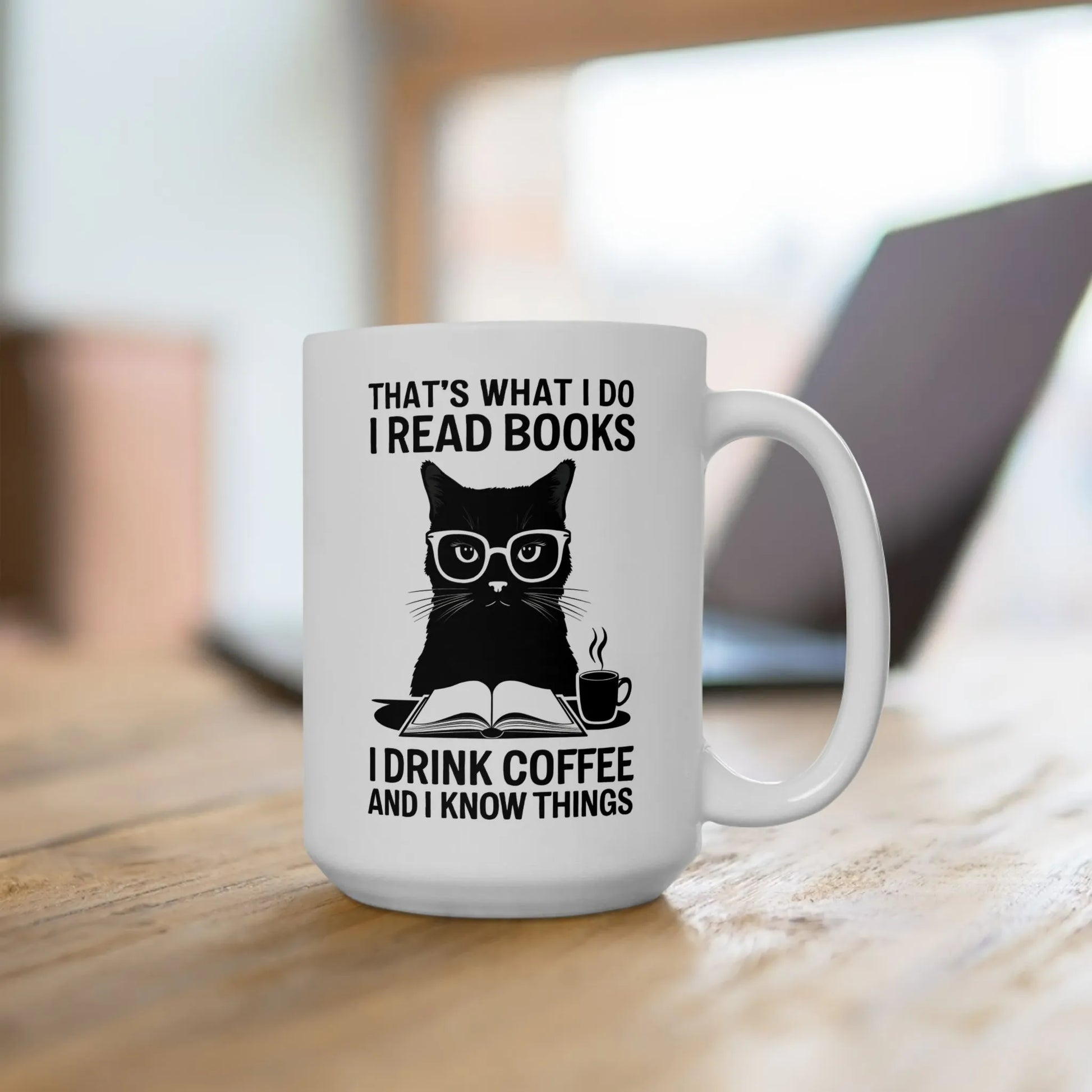 Coffee & Cat Wisdom Mug featuring a stylish cat in glasses saying 'I drink coffee and I know things' for book lovers.
