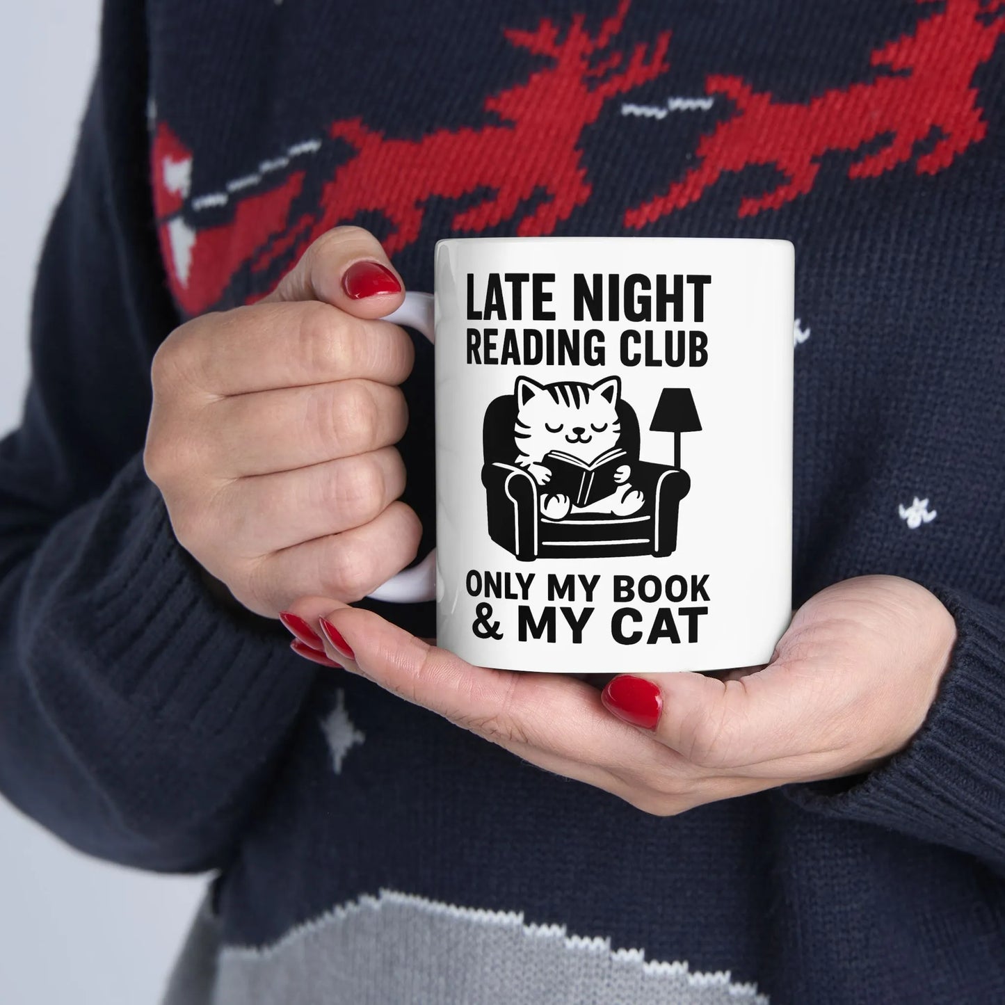 Cozy Late Night Reading Club Mug featuring a cat reading in a chair, perfect for book lovers and cat parents.