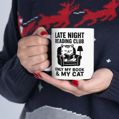 Cozy Late Night Reading Club Mug featuring a cat reading in a chair, perfect for book lovers and cat parents.