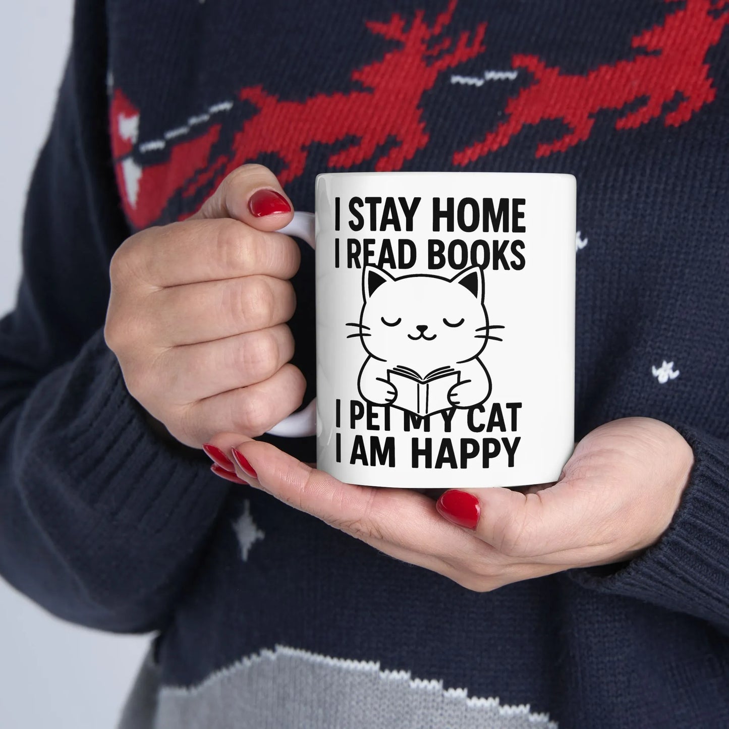 Happy Cat Reader Mug featuring a cute cat illustration with text: "I STAY HOME I READ BOOKS I PET MY CAT I AM HAPPY" perfect for cat-loving bookworms.