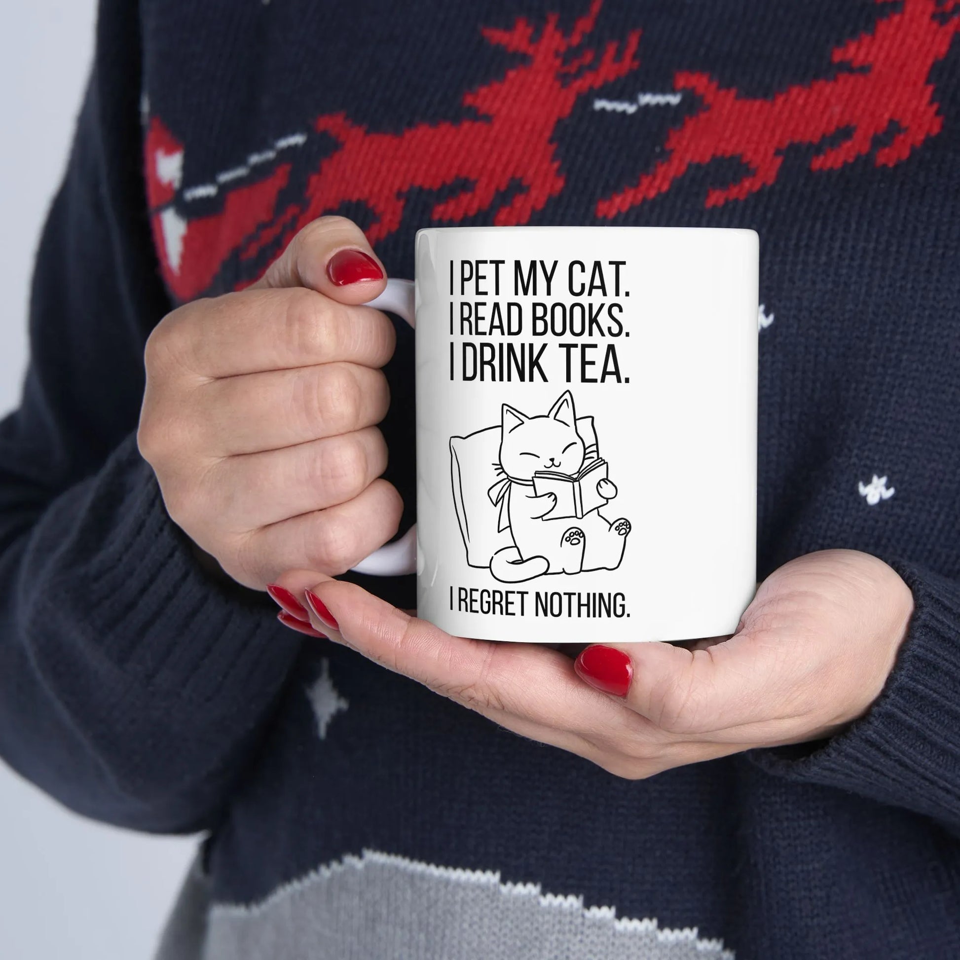 Purrfect Tea & Tales Mug with a reading kitty illustration and humorous text, perfect for cozy book lovers.