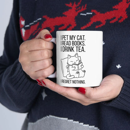 Purrfect Tea & Tales Mug with a reading kitty illustration and humorous text, perfect for cozy book lovers.