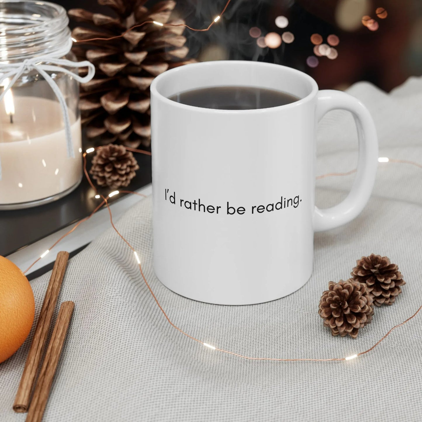 A cozy Rather Be Reading Mug with a minimalist design, perfect for book lovers enjoying coffee or tea.