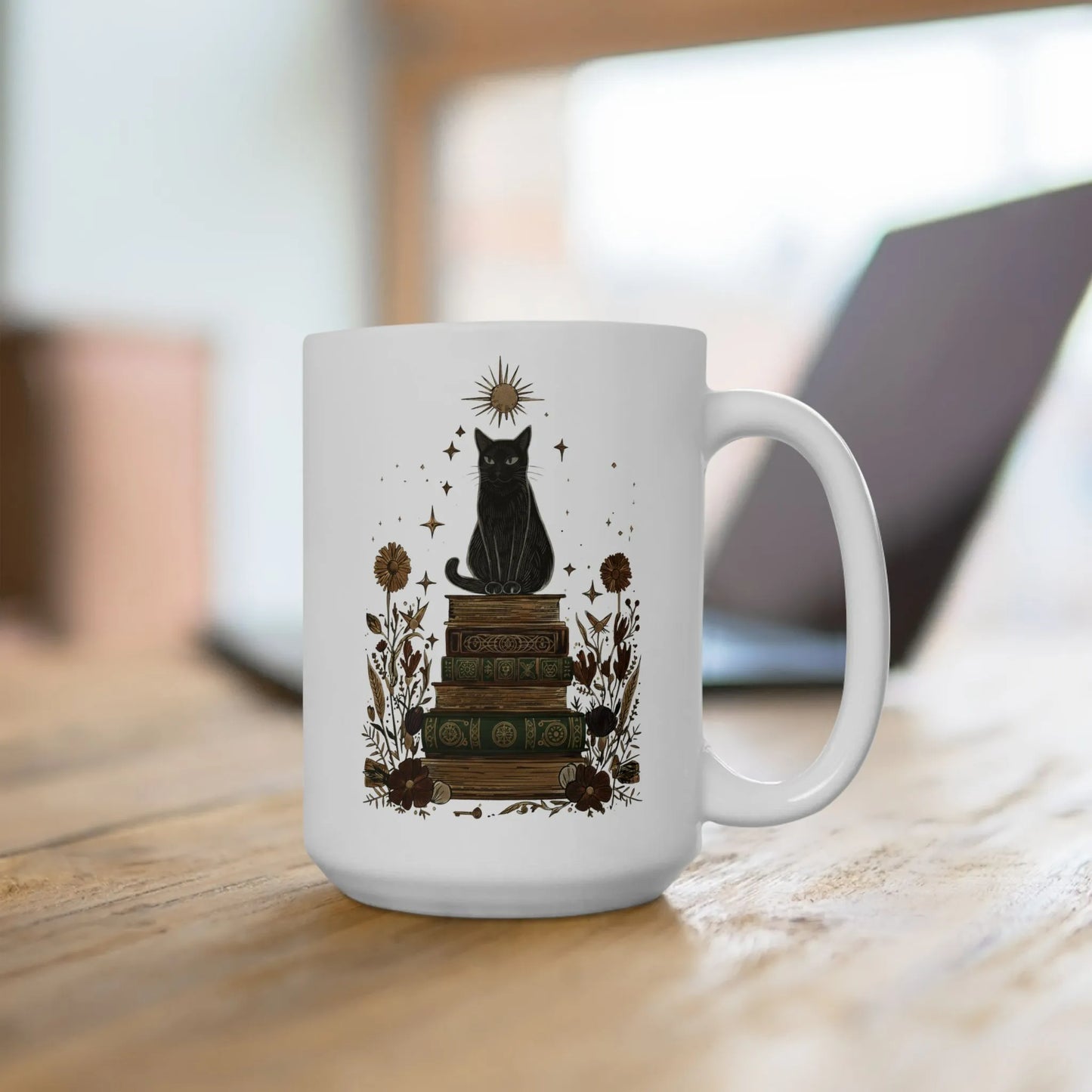 Mystic Cat & Books Mug featuring a black cat atop vintage books with celestial accents, perfect for cozy reading moments.